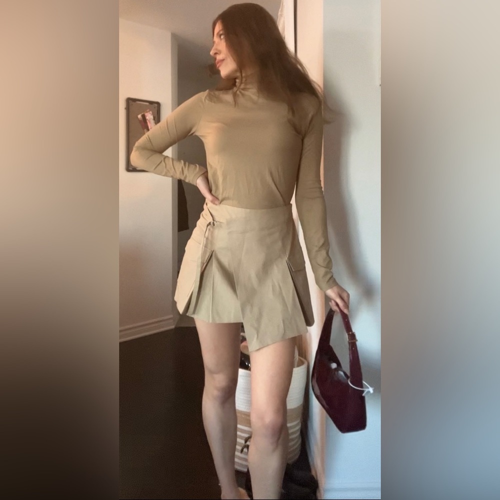 Tan turtleneck sweater​